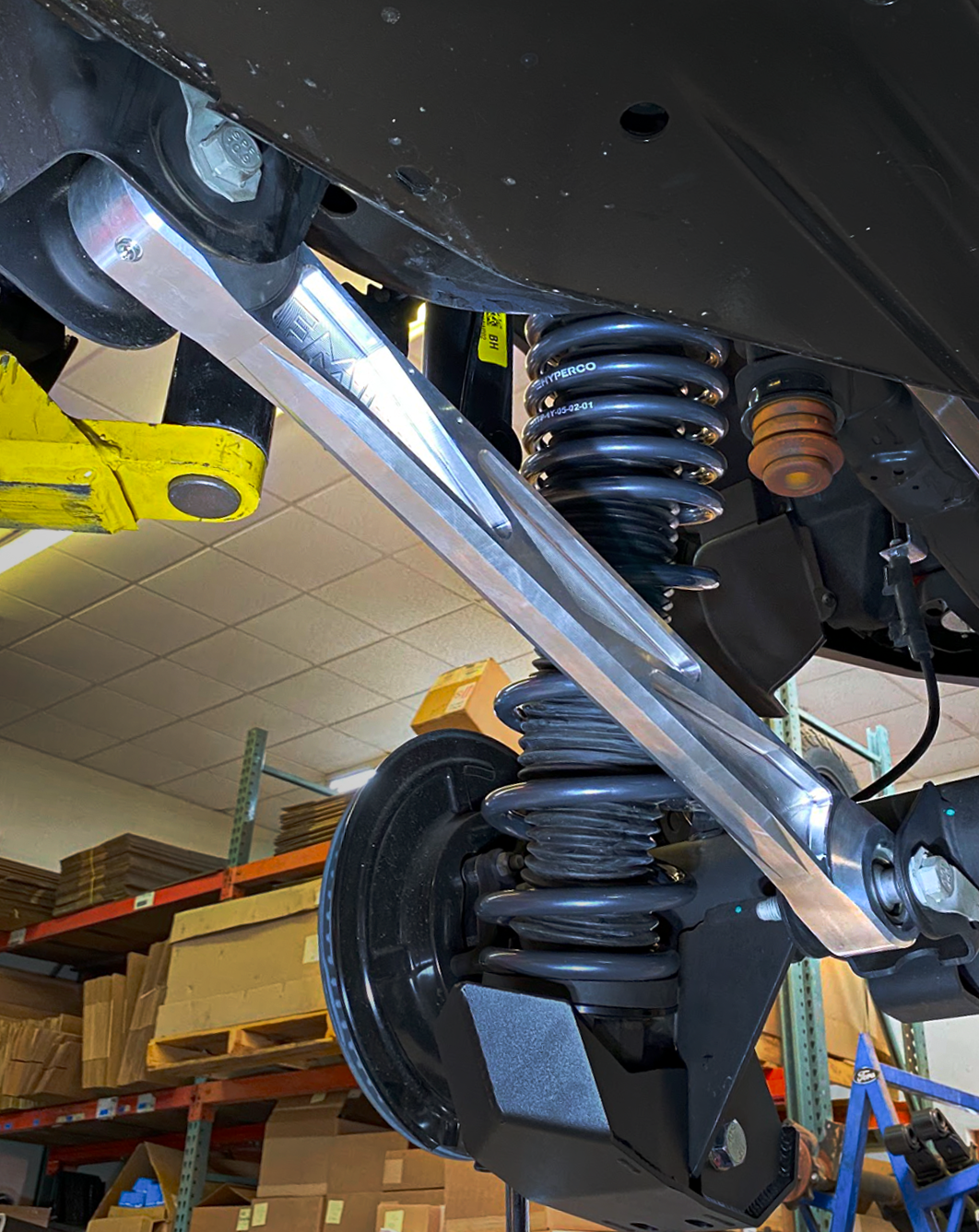 Billet aluminum rear lower suspension arms with ultra-flex joints installed on a 2022 Bronco Raptor, showcasing durability and performance.