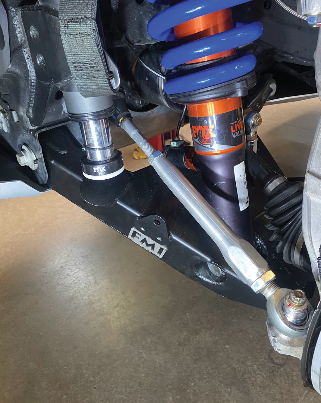 Fabricated lower control arms for 2022+ Bronco Raptor, showcasing stock width and high-performance suspension components.