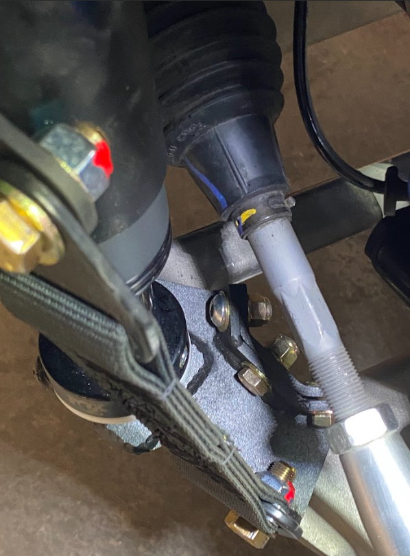 Front limit strap and bump stop for 2022+ Bronco Raptor, designed for stock lower arm installation. Durable and reliable components.