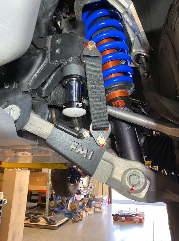Front limit strap and bump stop for 2022+ Bronco Raptor, showcasing stock lower arm and suspension components.