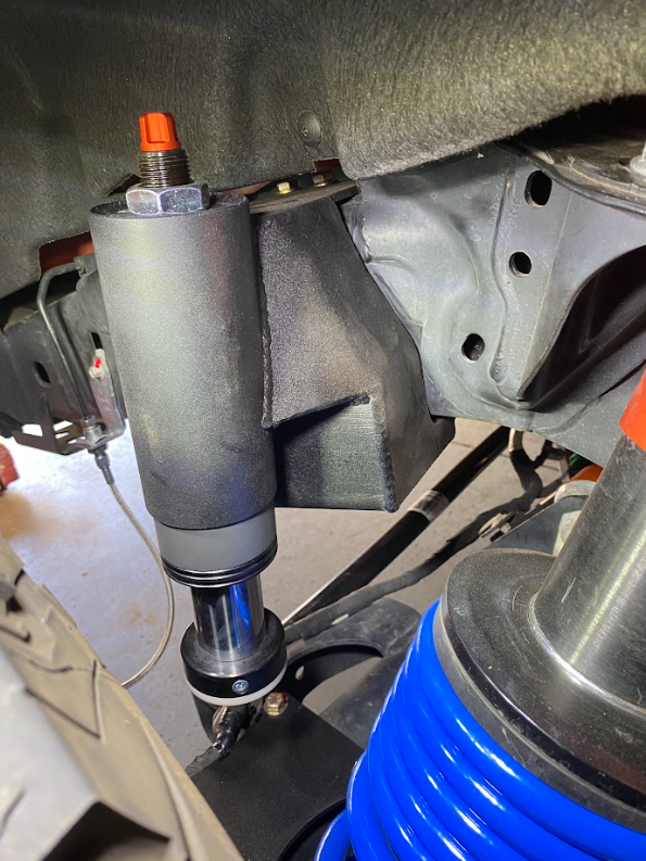Rear hydraulic bump stop kit for 2022+ Bronco Raptor, showcasing installation details and components for offroad performance.