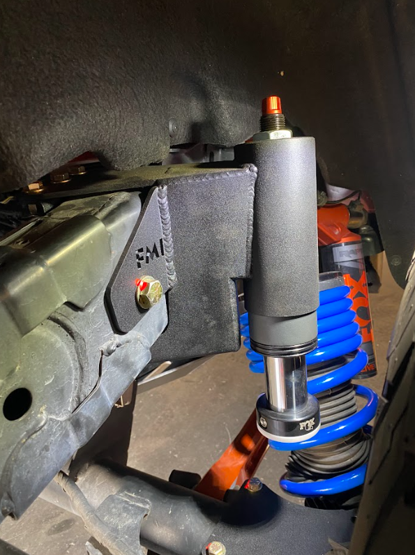 Rear hydraulic bump stop kit for 2022 and newer Bronco Raptor, showcasing installation with shock absorber and suspension components.