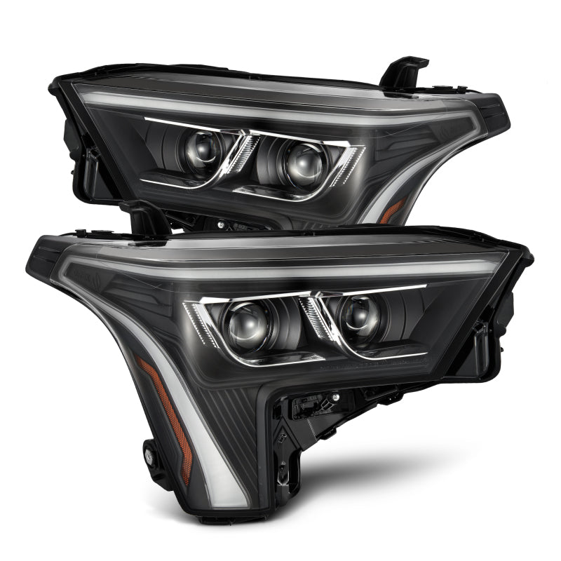 AlphaRex LUXX-Series black headlights for 22-23 Toyota Tundra with amber daytime running lights. Enhanced visibility and style.