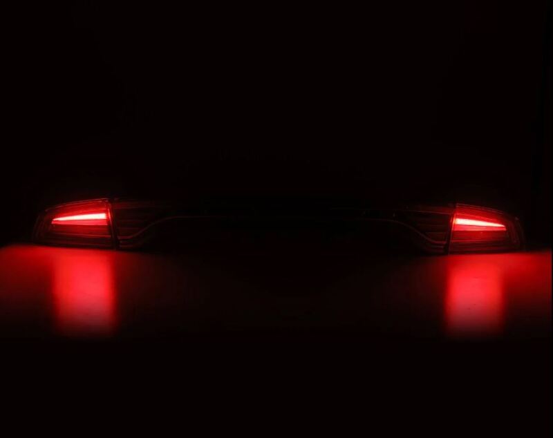 AlphaRex Nova-Series LED tail lights for 2015-2023 Dodge Charger in smoke finish, showcasing a sleek design with red illumination.