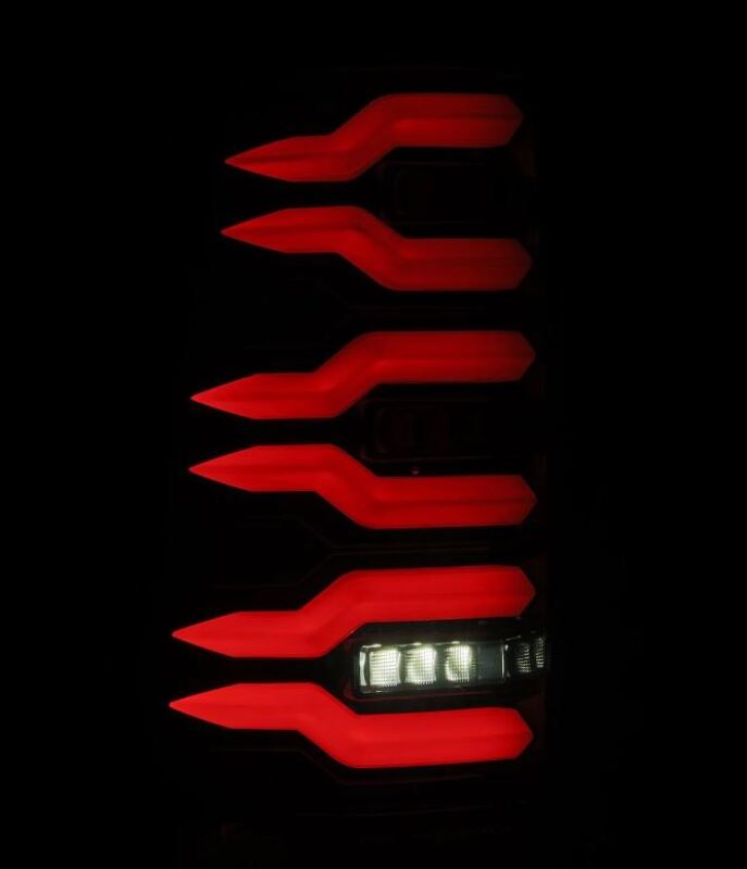 AlphaRex LUXX-Series LED tail lights for 99-06 Chevrolet Silverado and GMC Sierra in black with striking red accents.