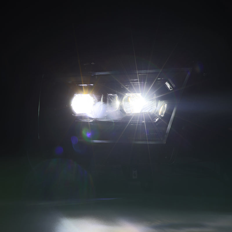 AlphaRex LUXX LED projector headlights for 2019-2022 Ram 1500 in alpha black, showcasing bright illumination and modern design.