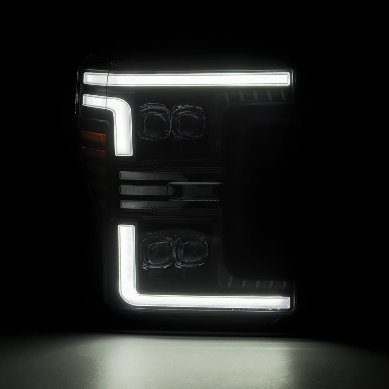 AlphaRex NOVA-Series LED projector headlights for 2017-2019 Ford F-250/350/450, featuring a sleek black design and daytime running lights.