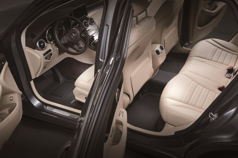 3D MAXpider 2026 Tesla Model Y Juniper Kagu black second row floormats in a vehicle interior with beige seats.