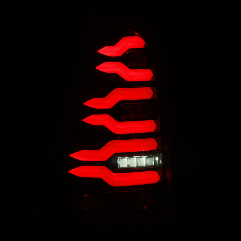 AlphaRex LUXX-Series LED tail lights for 2003-2009 Toyota 4Runner in black, showcasing a modern design with bright red illumination.