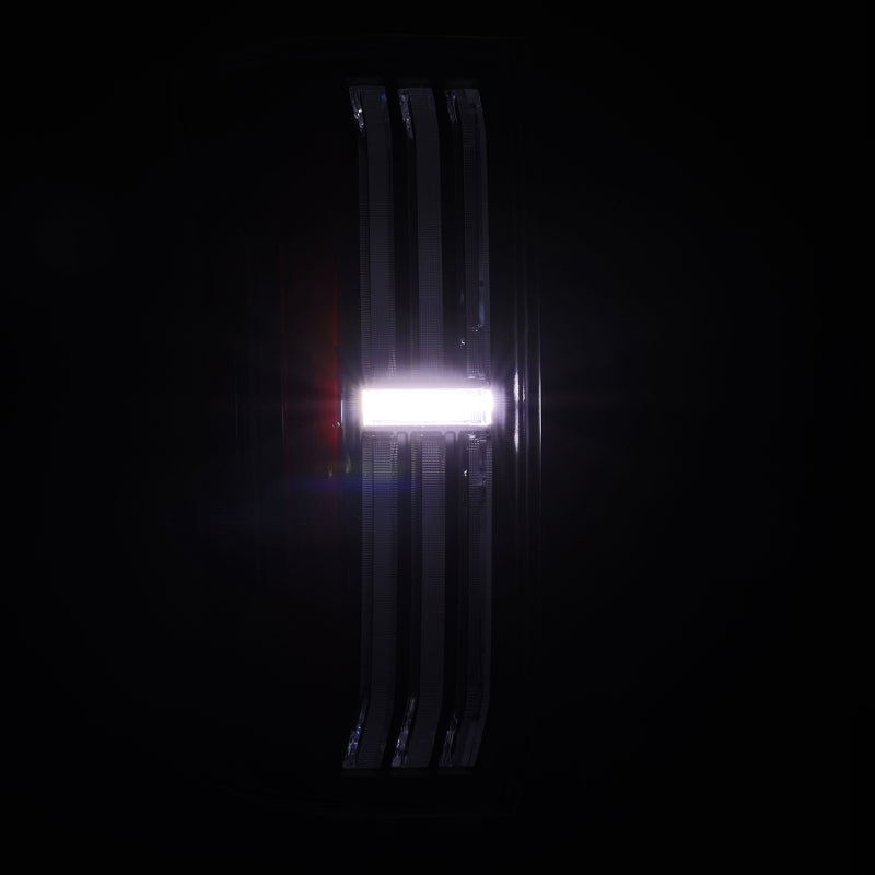 AlphaRex NOVA-Series LED prismatic tail lights for 24-25 Toyota Tacoma in black and red, showcasing a sleek design.