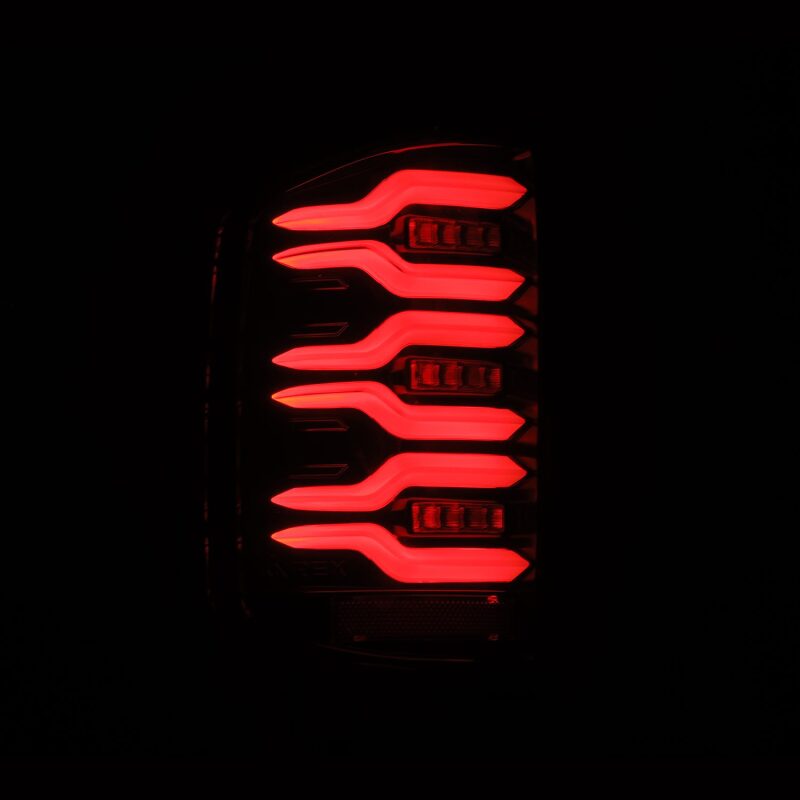 AlphaRex LED tail lights for 14-18 Chevy Silverado 1500 in alpha-black with sequential signal and active light feature.