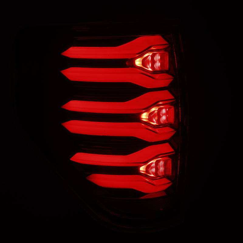 AlphaRex LUXX LED taillights for 09-14 Ford F150 in AlphaBlack housing, showcasing a sleek red light design.