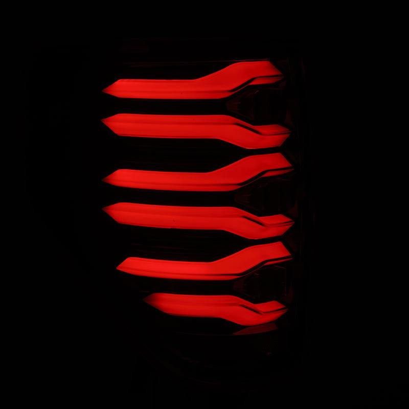 AlphaRex LUXX LED taillights for 09-14 Ford F150 in AlphaBlack housing, featuring a sleek, modern design with bright red illumination.