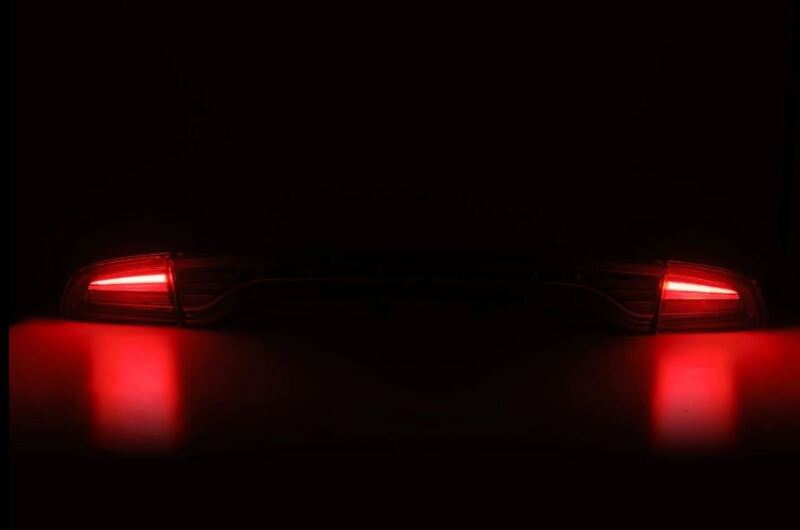 AlphaRex Nova-Series LED tail lights for 2015-2023 Dodge Charger in black, showcasing a sleek design with bright red illumination.