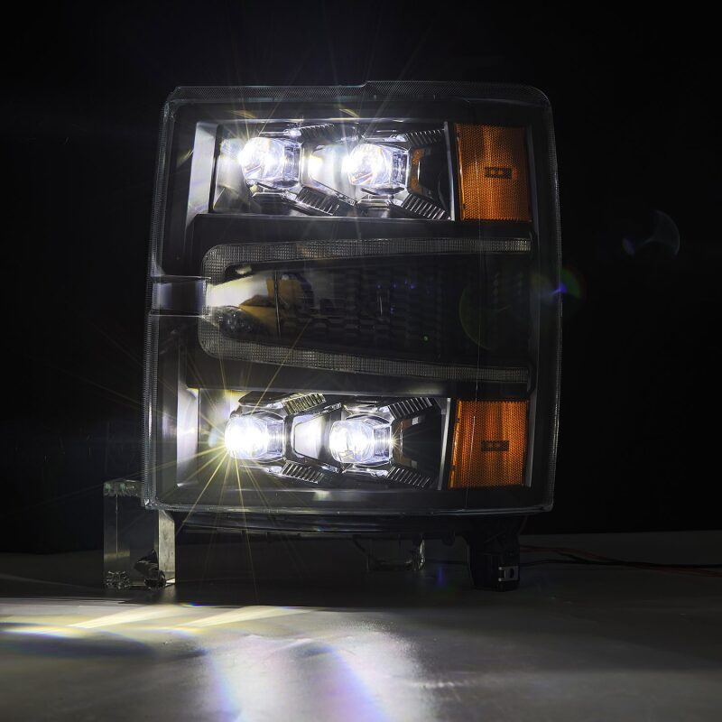 AlphaRex NOVA-Series LED projector headlights for 04-15 Chevy 1500HD with black housing, sequential signals, and daytime running lights.