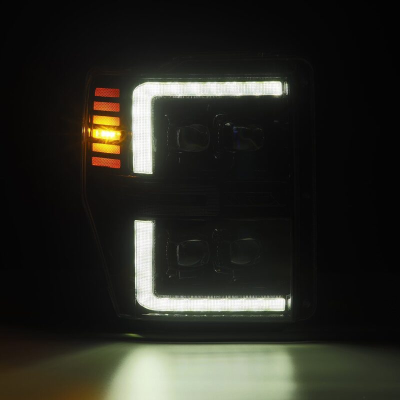 AlphaRex NOVA-Series LED projector headlights for 08-10 Ford F250-550 with black housing and sequential signals.