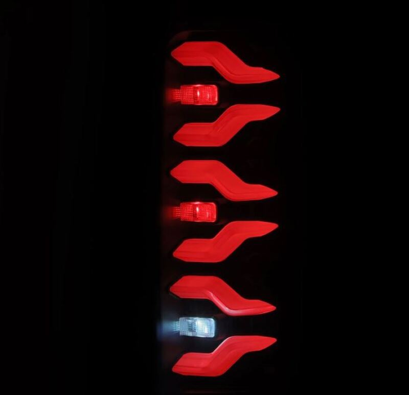 AlphaRex Luxx-Series LED tail lights for 87-96 Ford Bronco and F-150 in black, featuring a sleek design with red and white lights.