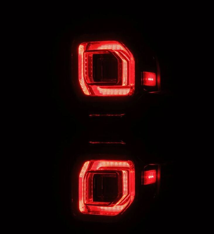 AlphaRex 21-24 Ford Bronco NOVA LED tail lights in alpha-black, showcasing a sleek design with vibrant red illumination.