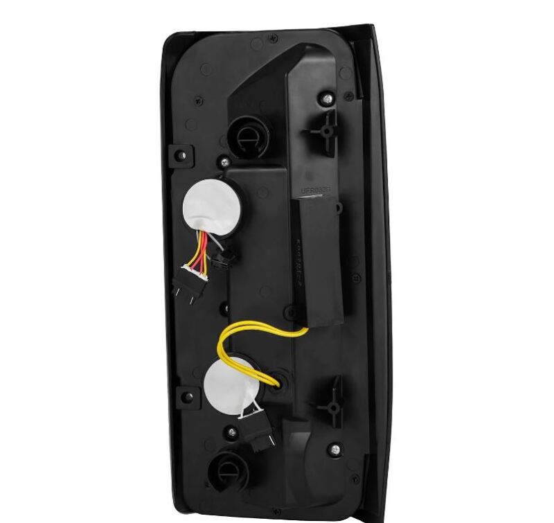 AlphaRex Luxx-Series LED tail lights for 87-96 Ford Bronco and F-150 in black, showcasing the rear view and wiring connections.