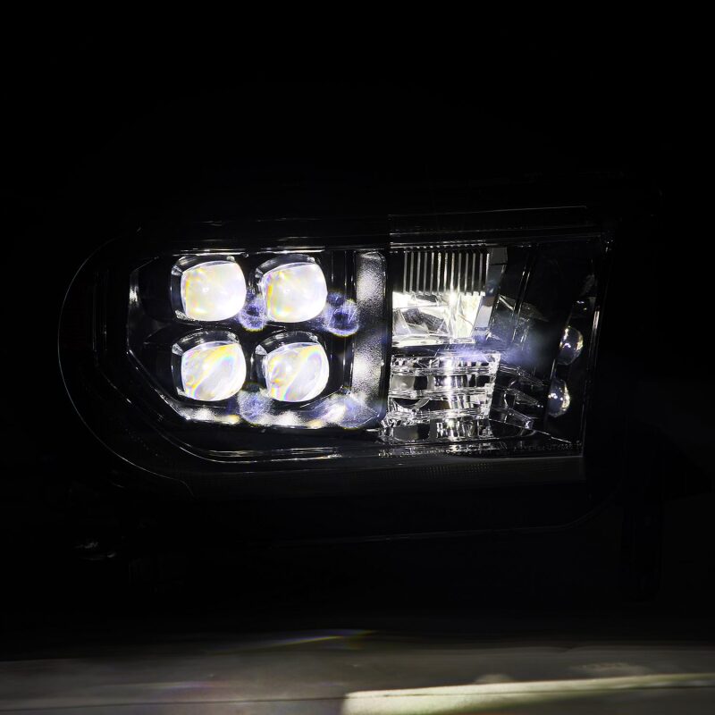 AlphaRex NOVA LED projector headlights for 07-13 Toyota Tundra in black with sequential signals and DRL features.