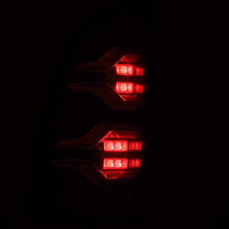 AlphaRex LUXX LED taillights for 05-15 Toyota Tacoma in black with sequential signals and active lighting.