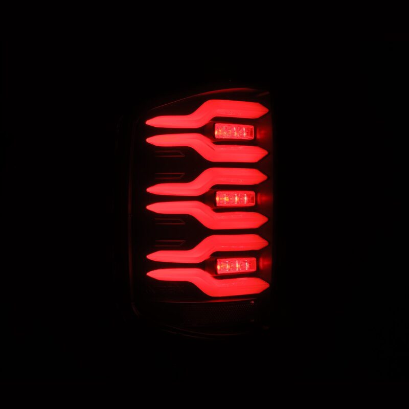 AlphaRex Luxx-Series LED tail lights for 14-18 Chevrolet Silverado featuring a black finish and sequential signal lights.