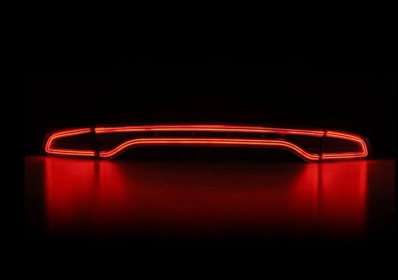 AlphaRex Nova-Series LED tail lights for 15-23 Dodge Charger in Alpha-Black, showcasing a sleek red design.