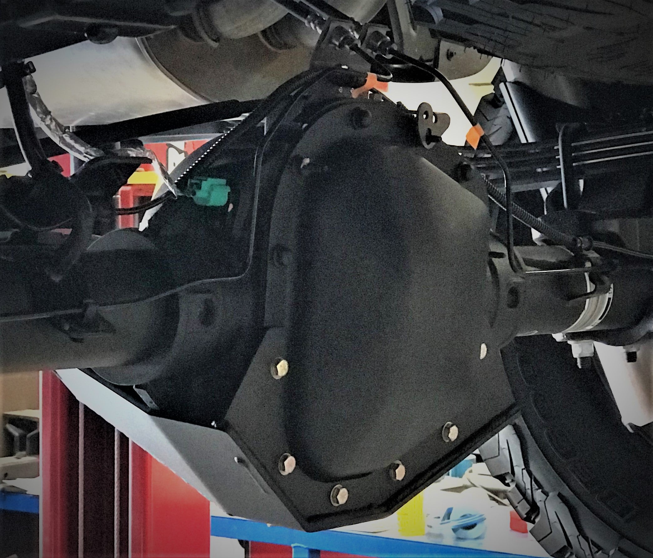 2017-2024 Raptor rear differential skid plate kit installed, providing protection for offroad driving.