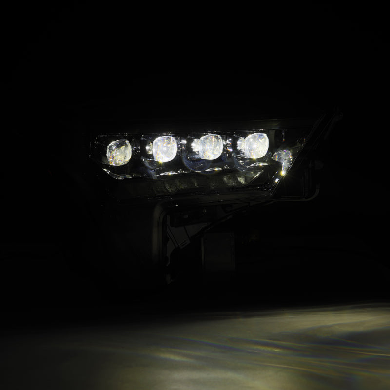 AlphaRex NOVA-Series headlights for 2022-2023 Toyota Tundra in alpha-black with amber daytime running lights.