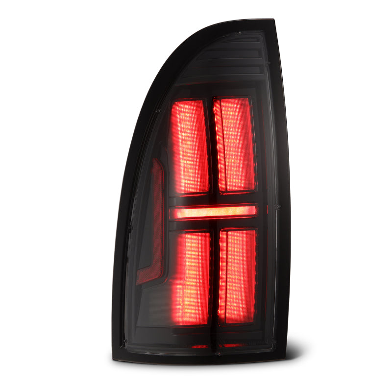 AlphaRex NOVA Prismatic LED tail light for 2005-2015 Toyota Tacoma in alpha-black finish, featuring a sleek design and bright illumination.
