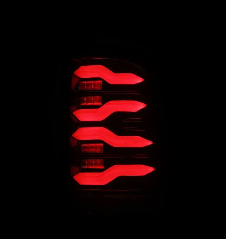 AlphaRex LUXX-Series LED taillights for 09-18 Dodge RAM in black and red, featuring an active light design.
