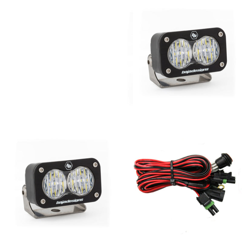 Baja Designs S2 Sport LED work lights with a wide cornering pattern, featuring a clear lens and wiring harness.