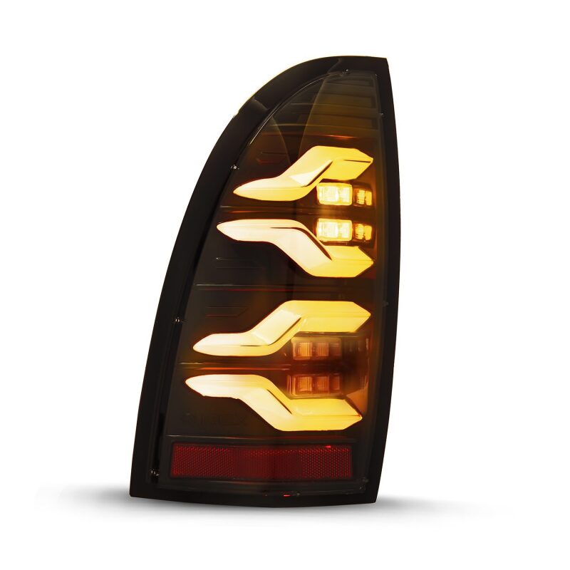 AlphaRex LUXX LED taillights for 05-15 Toyota Tacoma in black with sequential signal and active light features.