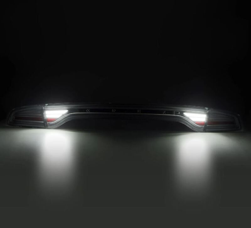 AlphaRex Nova-Series LED tail lights for 2015-2023 Dodge Charger in black, showcasing sleek design and bright illumination.
