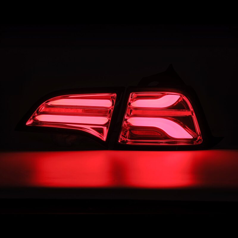 AlphaRex PRO-Series LED tail lights for 17-22 Tesla Model 3 in red smoke with sequential signals, enhancing visibility and style.