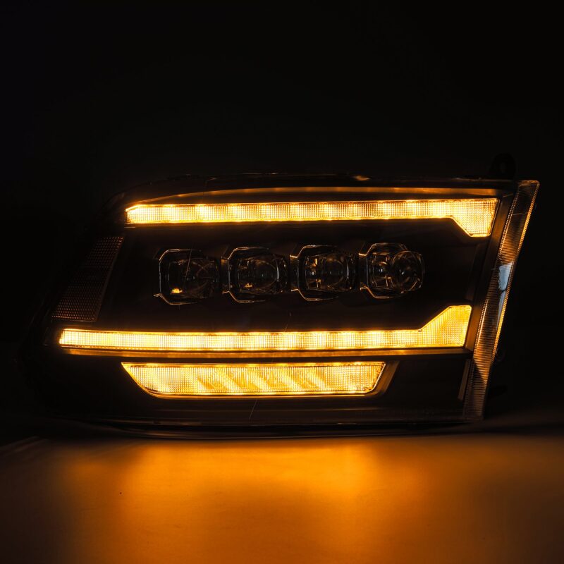 AlphaRex NOVA LED projector headlights for 09-18 Dodge Ram 2500 in black with plank style design and activation light.