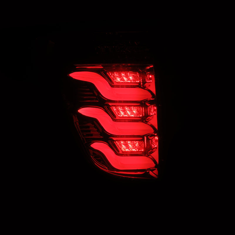 AlphaRex PRO-Series LED tail lights for 11-15 Ford Explorer with a sleek red smoke design, enhancing visibility and style.