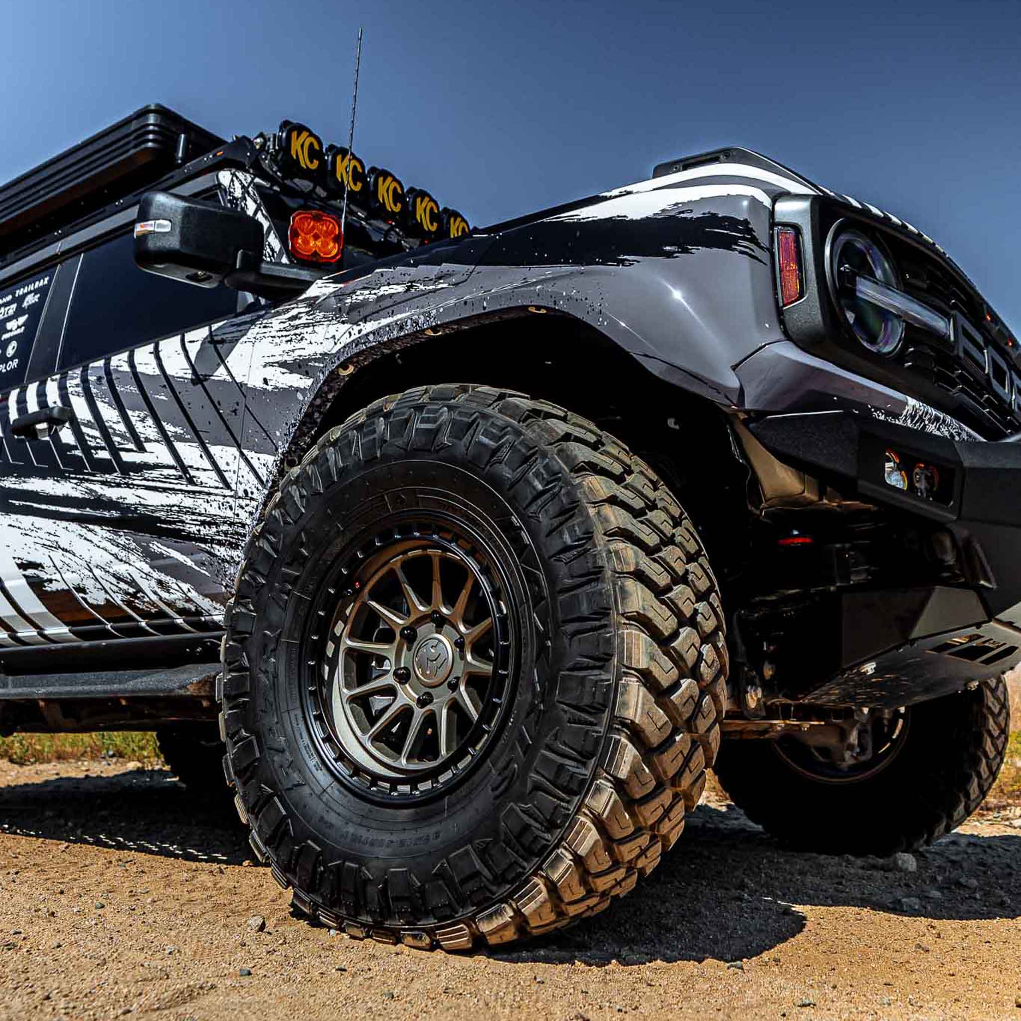 2022-2025 Ford Bronco Raptor fenders showcasing rugged design and off-road capabilities with aggressive tires and custom graphics.