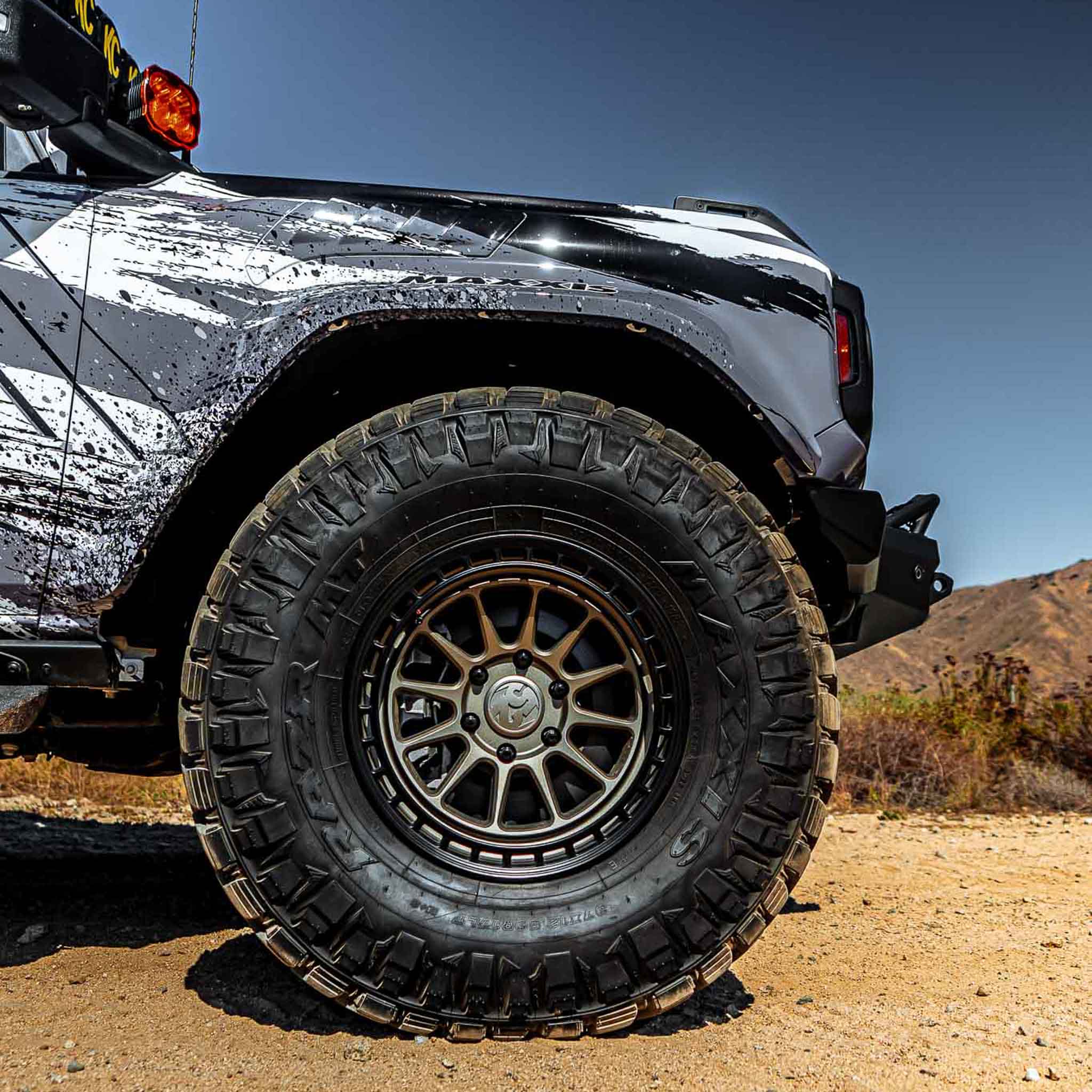2022-2025 Ford Bronco Raptor fenders showcasing rugged design and off-road capability on a desert landscape.