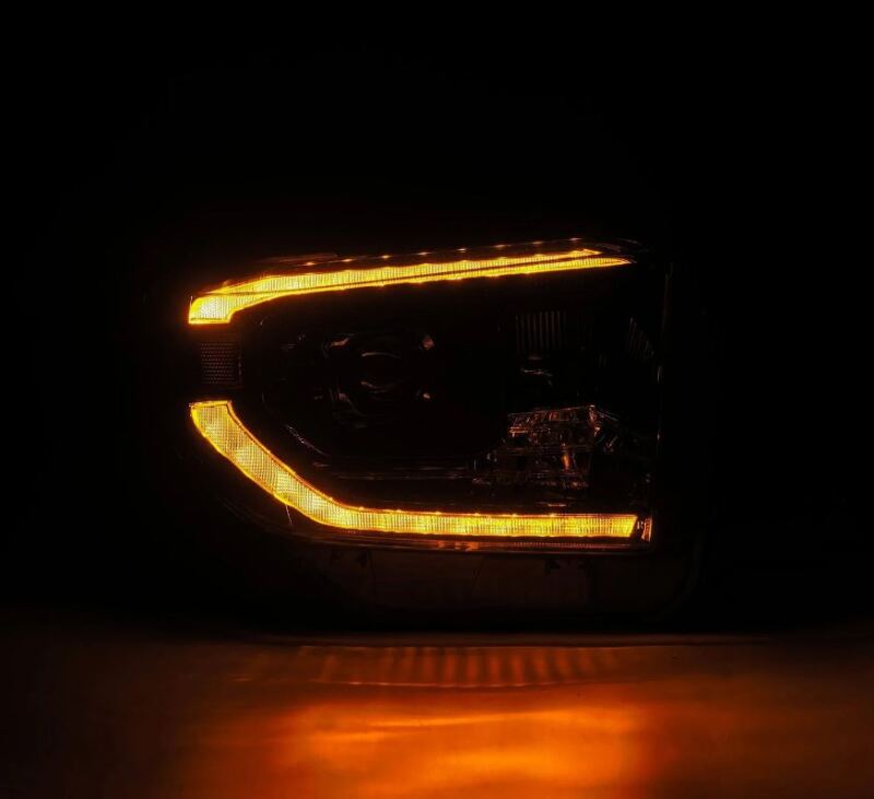 AlphaRex 14-21 Toyota Tundra PRO-Series black projector headlights with sequential signal and daytime running lights.