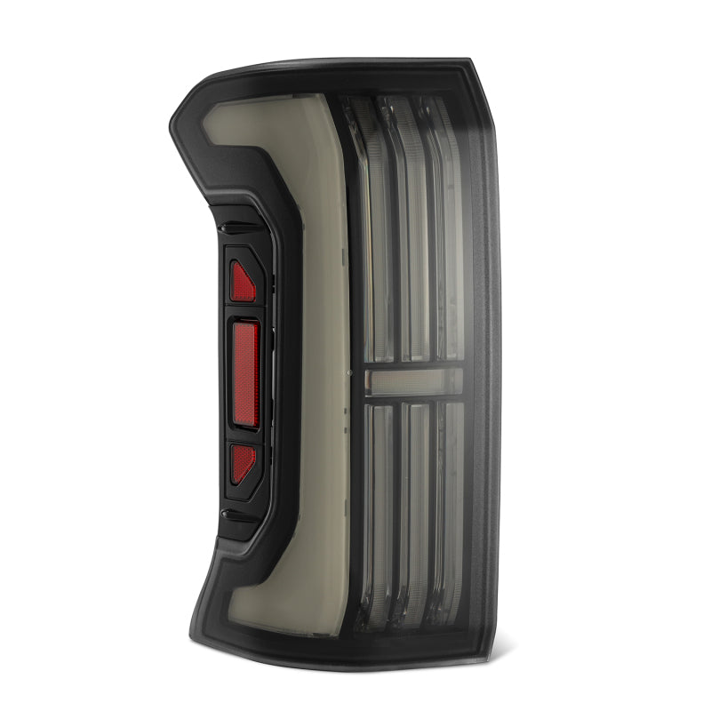 AlphaRex NOVA-Series LED prismatic tail lights for 24-25 Toyota Tacoma in Alpha-Black finish, featuring a sleek design.