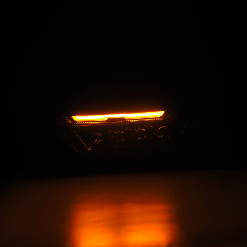 AlphaRex NOVA LED projector headlights for 2019-2023 Toyota RAV4 in alpha-black finish, showcasing an illuminated amber light.