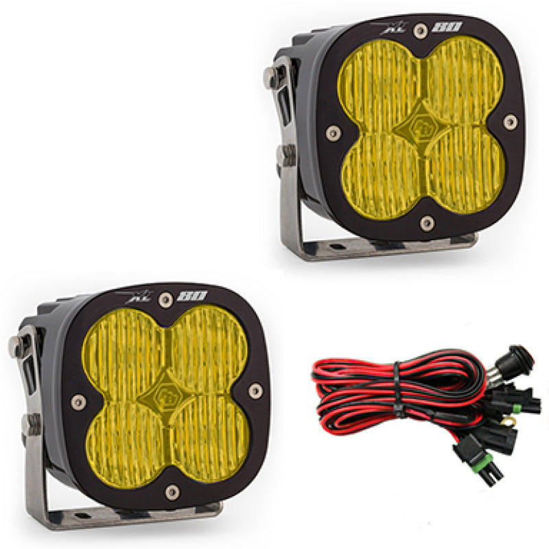 Baja Designs XL80 Series amber LED light pods with wide cornering pattern, featuring durable housing and wiring harness.