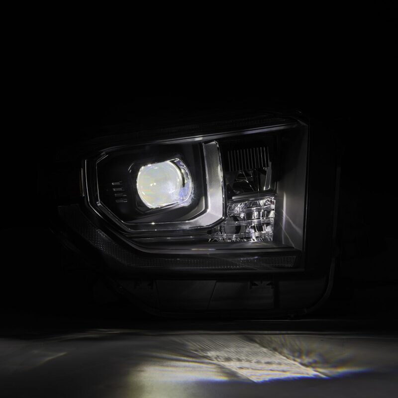 AlphaRex LUXX-Series LED projector headlights for 14-21 Toyota Tundra, featuring black housing, active light, and sequential signals.
