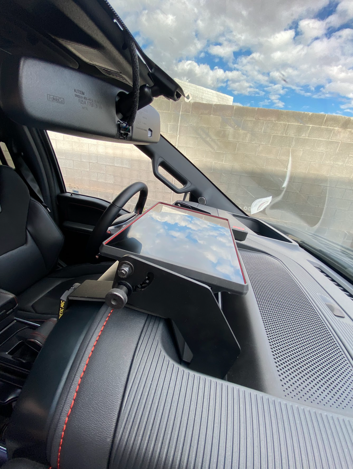 Center dash fold-down GPS mount for 2024+ Gen 3.5 Raptor, designed for Garmin TREAD XL, showcasing sleek installation in vehicle.