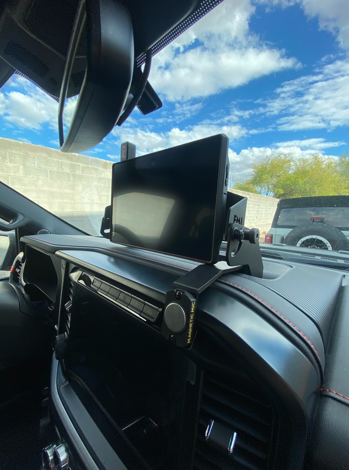 Center dash fold-down GPS mount for 2024+ Gen 3.5 Raptor, designed for Garmin TREAD XL, showcasing a sleek installation.