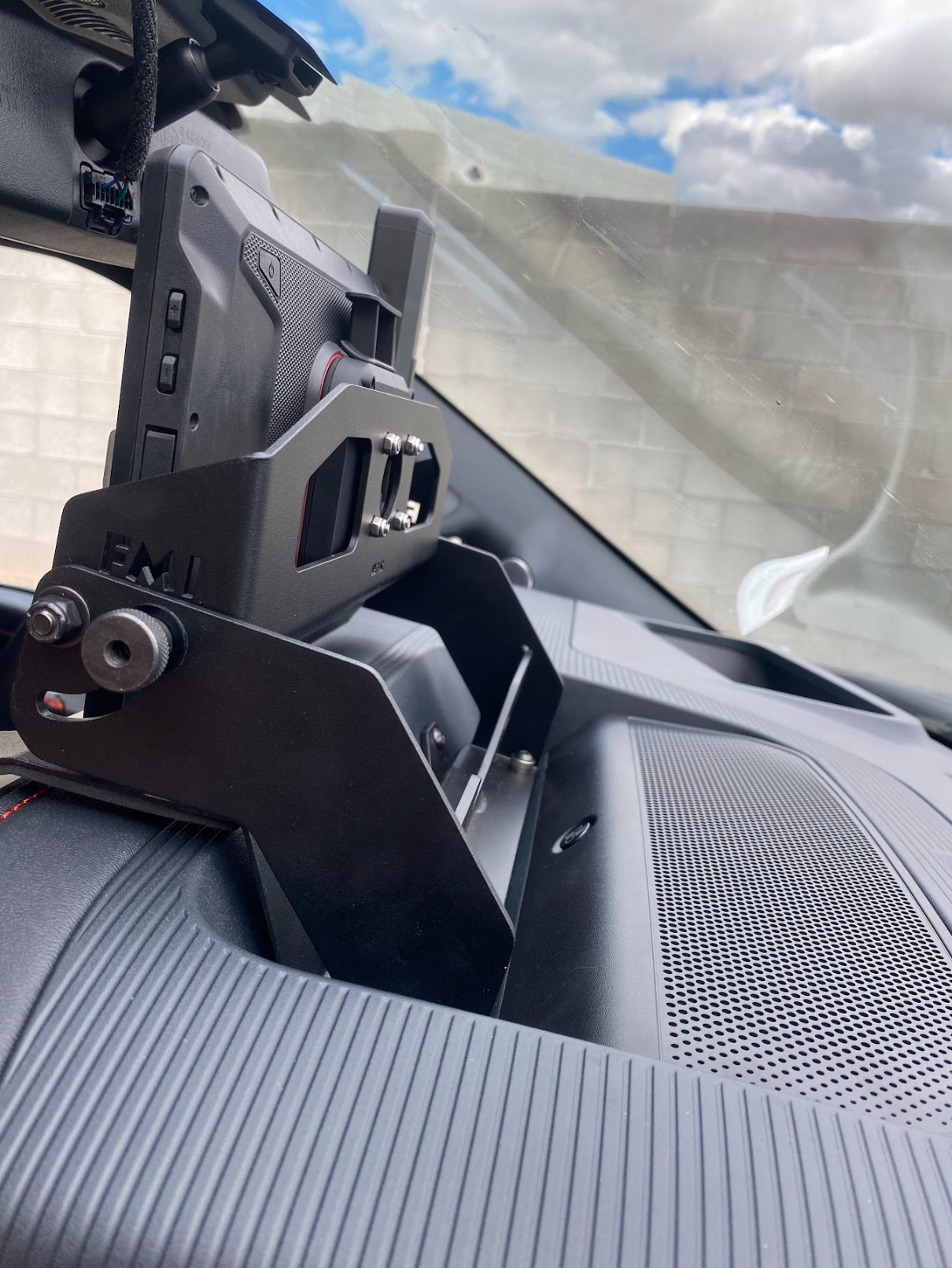 Center dash fold-down GPS mount for 2024+ Gen 3.5 Raptor, designed for Garmin TREAD XL, showcasing a sleek installation.