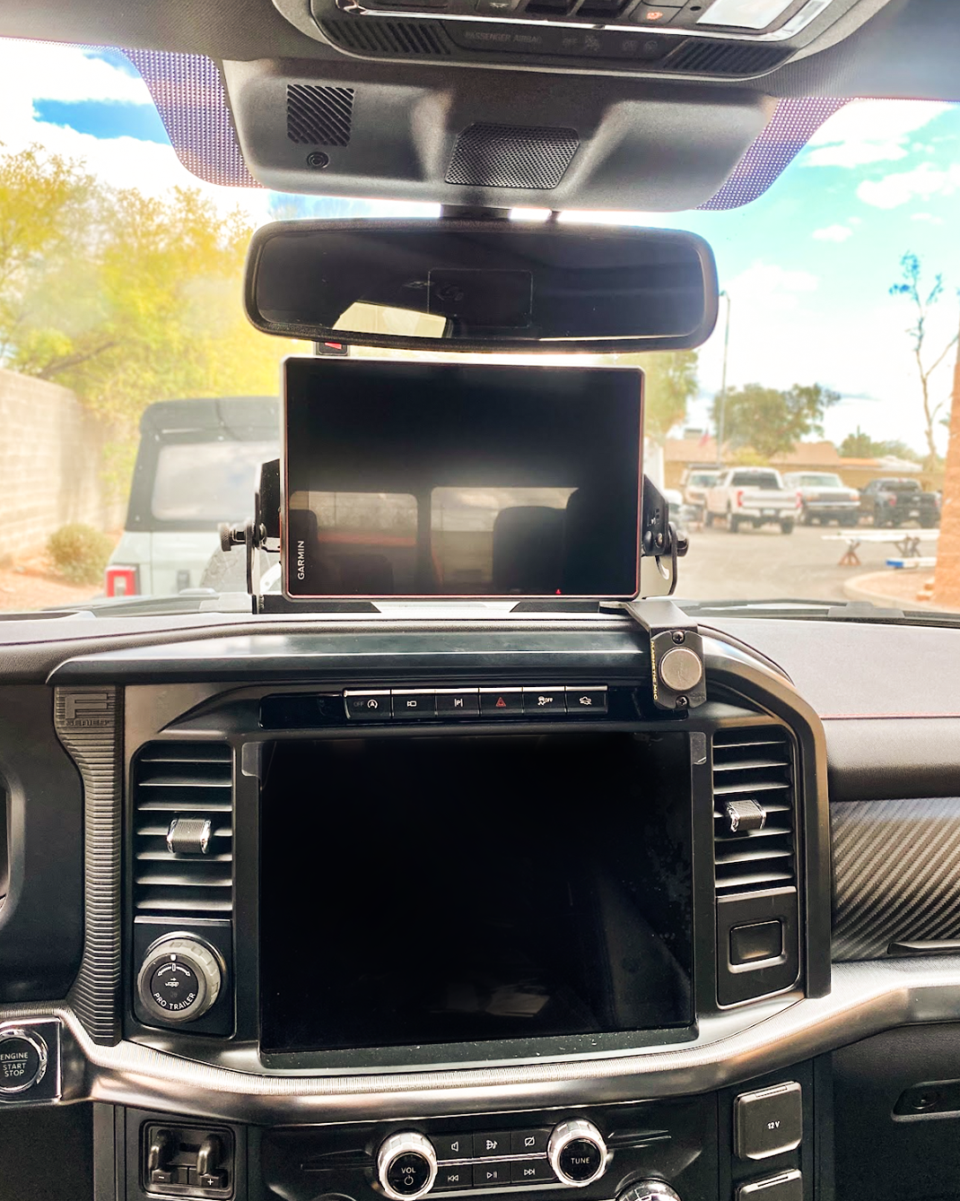 Center dash fold-down GPS mount for 2024+ Gen 3.5 Raptor, designed for Garmin TREAD XL, showcasing sleek installation.