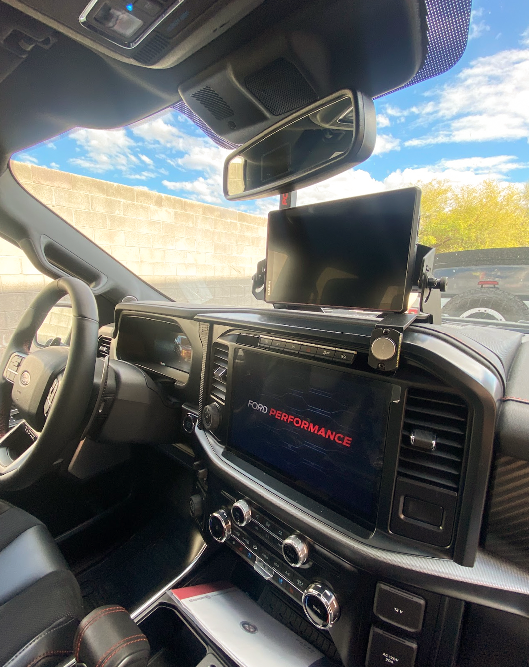 Center dash GPS mount for 2024+ Gen 3.5 Raptor, designed for Garmin TREAD XL, showcasing sleek interior and advanced tech.