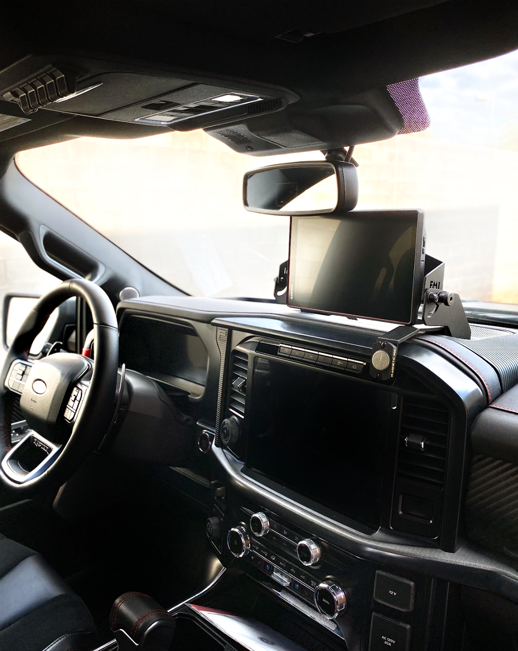 Center dash fold-down GPS mount for 2024+ Gen 3.5 Raptor, designed for Garmin TREAD XL, showcasing sleek interior fit.